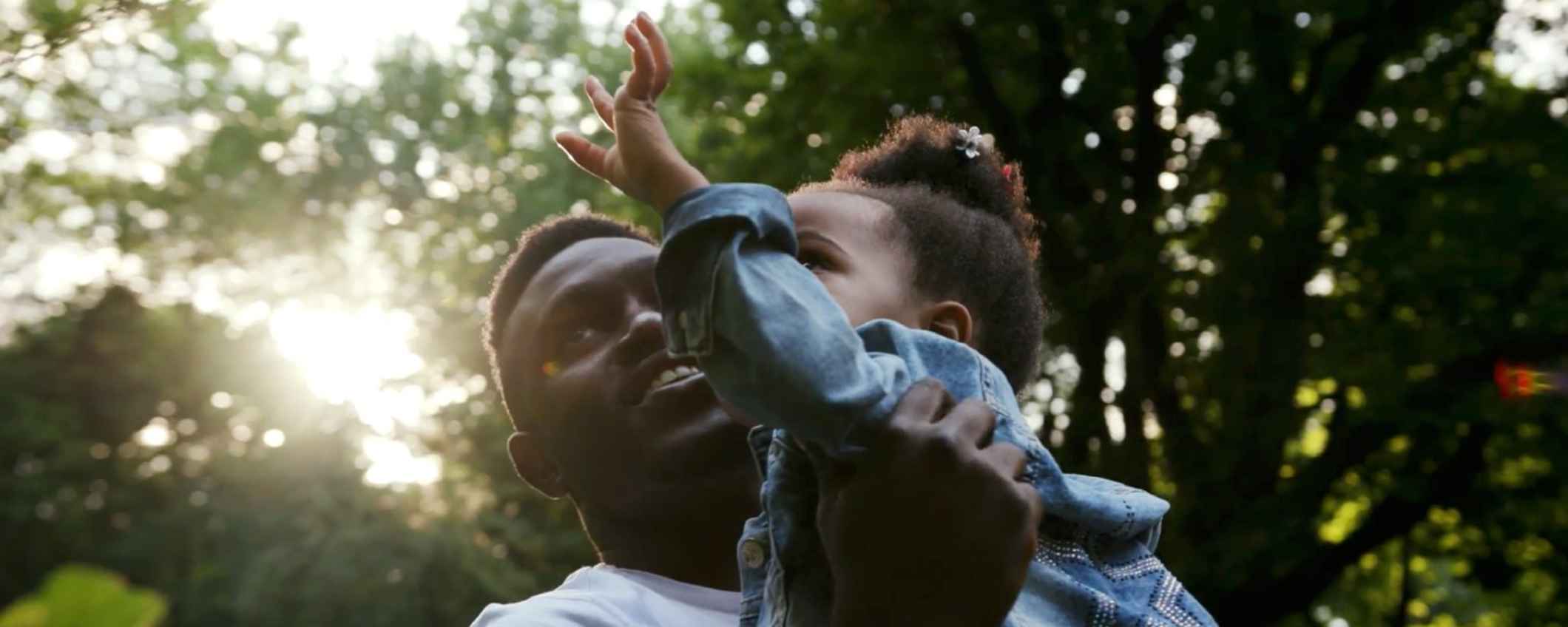 Man holding toddler