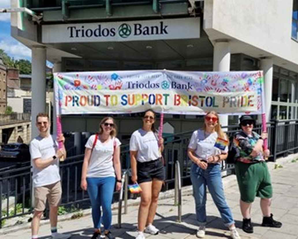 Triodos coworkers stood outside the Bristol office with a banner saying "proud to support Bristol Pride"